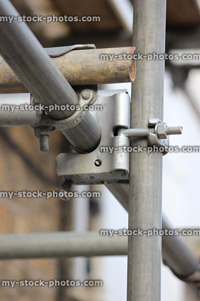 Stock image of steel scaffolding coupler / clamp / bracket, nuts and bolts