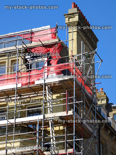 Stock image of metal scaffolding poles used for house / home repairs