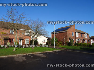 Stock image of modern housing estate with red brick houses / angular roofs