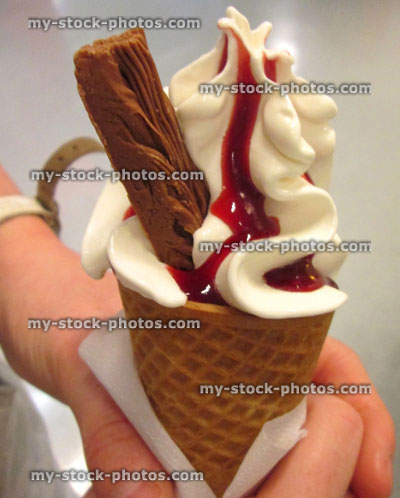 Stock image of whippy softee ice cream cone with strawberry sauce, 99 flake