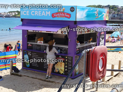 Stock image of dairy ice cream kiosk at seaside, on beach