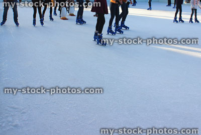 Stock image of children ice skating outdoors on frozen Christmas rink