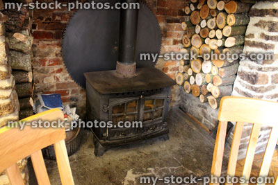 Stock image of pile of chopped logs / timber, wood burner firewood, inglenook fireplace