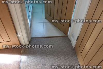 Stock image of three internal hardwood doors, different floors, carpet, tiles
