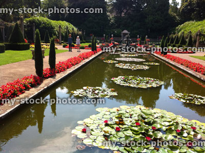 Stock image of beautiful landscaped Italian garden with pond, water lillies