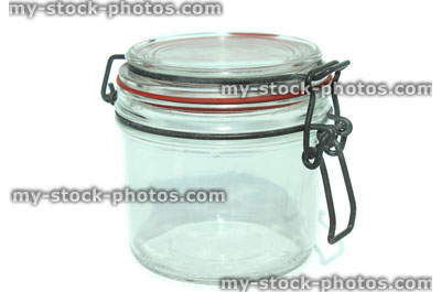 Stock image of glass storage jar with metal lever arm clip