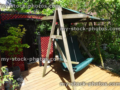 Stock image of homemade Japanese tea house with wooden garden swing seat