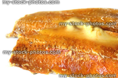 Stock image of kipper and butter for breakfast (smoked / cured herring)