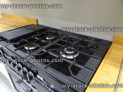 Stock image of traditional kitchen, gas hob, range cooker, wooden worktop