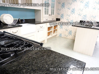 Stock image of country kitchen with granite worktop / countertop, cream cupboards