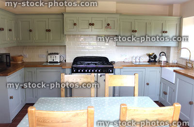 Stock image of traditional country kitchen, gas range cooker, Belfast sink, wooden worktops