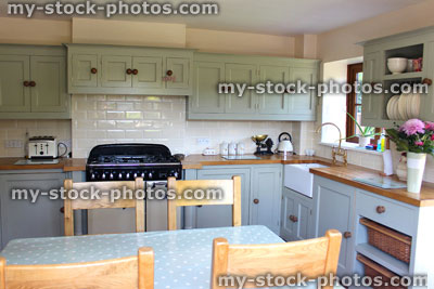 Stock image of traditional country kitchen, gas range cooker, Belfast sink, wooden worktops