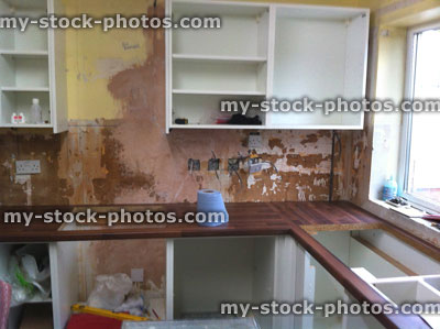Stock image of new kitchen being fitted, kitchen fitters, worktop, cabinets