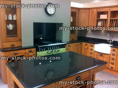 Stock image of traditional wooden kitchen with granite island
