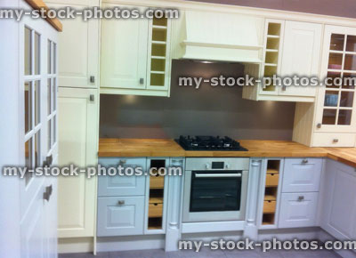 Stock image of modern white and cream wooden kitchen