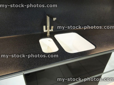 Stock image of monochrome, black / white double ceramic kitchen sink, stainless steel mixer tap, worktop