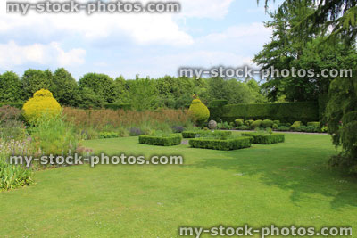 Stock image of landscaped knot garden with geometric clipped buxus hedges