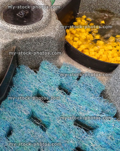 Stock image of plastic garden pond filter / koi carp, clover shape filter / filtration