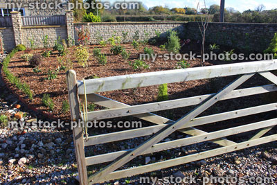 Stock image of five bar wooden gate / timber field gate to front garden