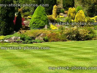 Stock image of beautiful green garden lawn, grass stripes, checkerboard effect