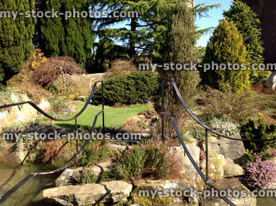 Stock image of black decorative iron railings, metal handrail in garden