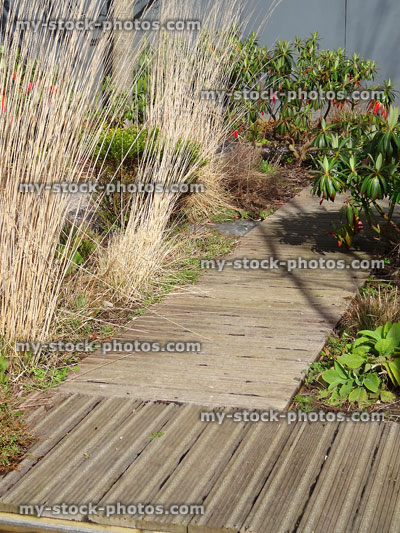 Stock image of wooden garden decking pathway with non slip / anti slip grips