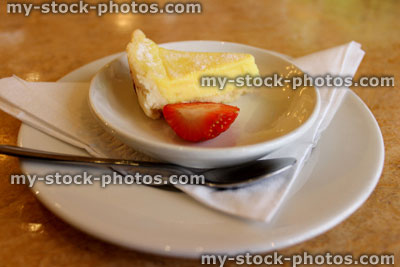 Stock image of small slice of lemon tart / torte, with strawberry