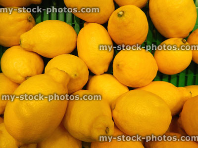 Stock image of organic fresh, ripe, unwaxed yellow lemons, supermarket, fruit shop