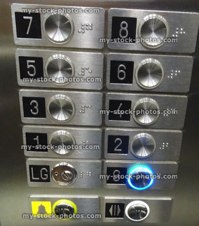 Stock image of buttons in lift / elevator keypad, stainless steel control panel, ground floor, Braille