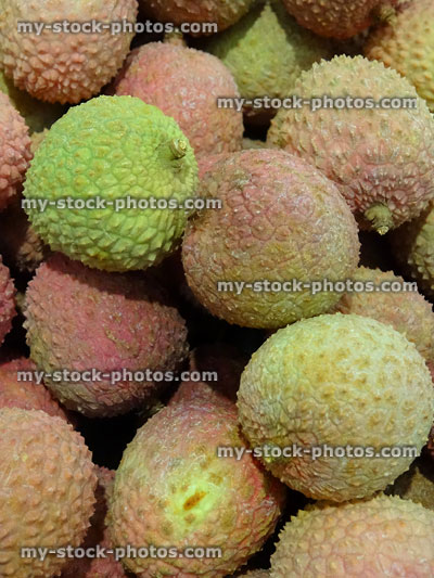 Stock image of crate of lychees fruit on supermarket shelves / greengrocers