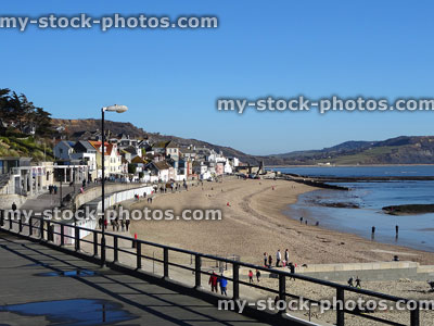 Stock image of holidaymakers on the beach at Lyme Regis, Dorset