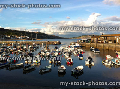 Stock image of harbour at Lyme Regis, with small boats / yachts