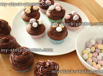 Stock image of Easter cup cakes with chocolate frosting, mini eggs