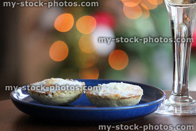 Stock image of two homemade mince pies on plate at Christmas