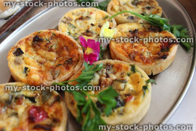 Stock image of small mini quiches / individual quiches, party food buffet