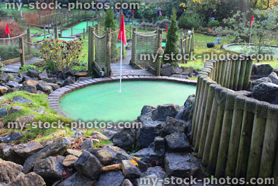Stock image of miniature golf course (crazy golf), putting greens / flags