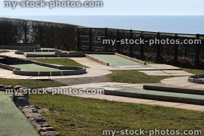 Stock image of mini golf course putting greens at seaside, sea views
