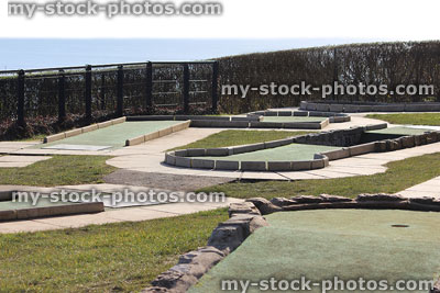 Stock image of miniature golf course putting greens at seaside beach resort