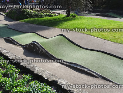 Stock image of children playing on miniature crazy golf course / mini golf