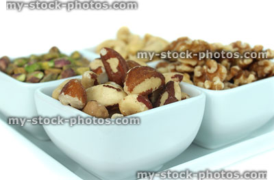 Stock image of mixed nuts, healthy snack food, cashews, walnuts, pistachios and brazils