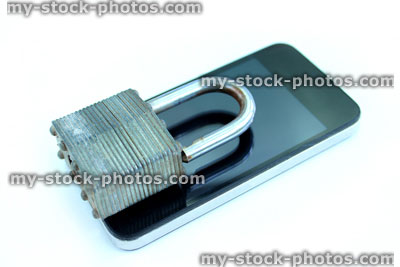 Stock image of mobile phone / smartphone, padlock reflection on glass screen