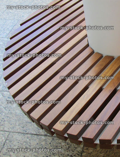 Stock image of modern curved, concrete / wooden bench slats, funky, trendy