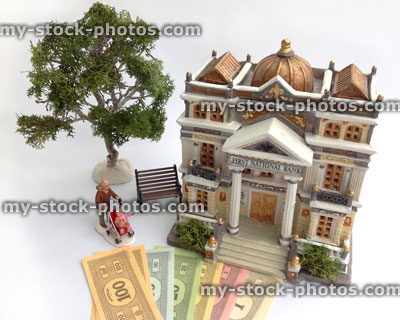 Stock image of model bank with paper toy money (cash)