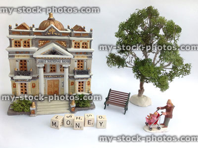 Stock image of model bank with money, mother and child