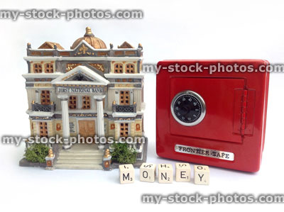 Stock image of money box (red safe) and model bank