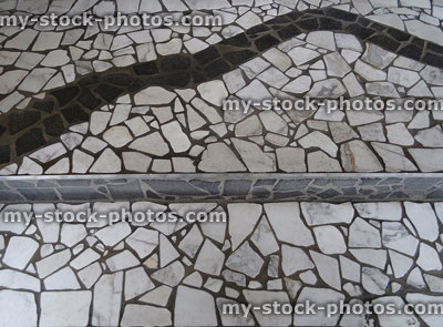 Stock image of marble mosaic floor with lines / curves, broken tiles