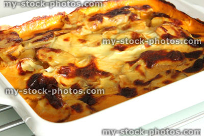 Stock image of freshly cooked moussaka meal in white oven dish