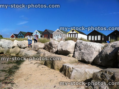 Stock image of mudeford beach huts with a summer sky