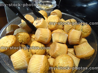 Stock image of glass bowl filled with small mini breakfast muffins (blueberry muffins)