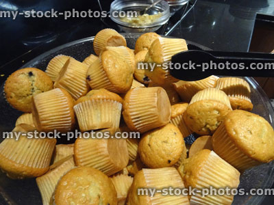 Stock image of glass bowl filled with small mini breakfast muffins (blueberry muffins)